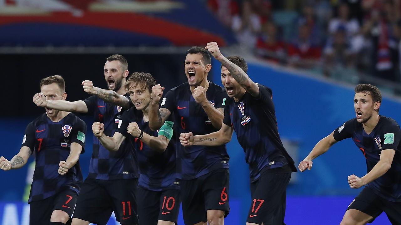 Croatia national soccer team players celebrate after winning the quarterfinal match against Russia.