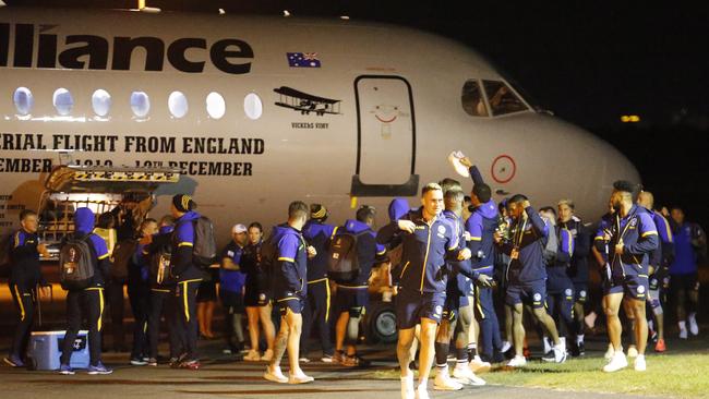 The Eels unpack their bags from their charter flight to Brisbane at Bankstown Airport just after 1am on Friday morning. Picture: Steve Tyson