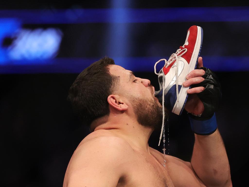 LAS VEGAS, NEVADA - DECEMBER 11: Tai Tuivasa of Australia drinks from his shoe as he celebrates his knockout victory over Augusto Sakai of Brazil during their heavyweight fight during the UFC 269 event at T-Mobile Arena on December 11, 2021 in Las Vegas, Nevada. (Photo by Carmen Mandato/Getty Images)