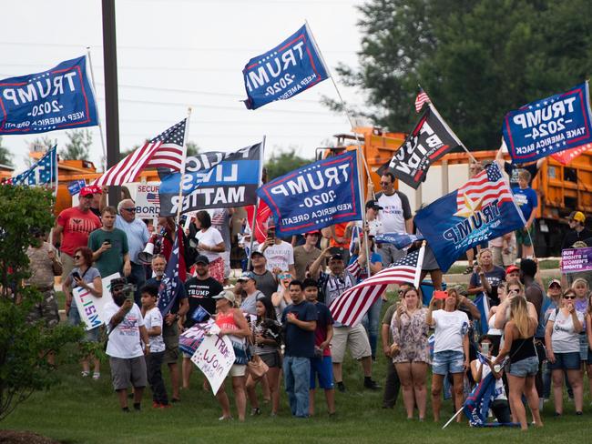 (FILES) In this file photo taken on July 07, 2021 supporters of former US President Donald Trump protest outside a visit by US President Joe Biden to McHenry County College in Crystal Lake, Illinois, as Biden travels to promote his economic plans. - Former US president Donald Trump announced plans October 20, 2021 to launch his own social networking platform called "TRUTH Social," which is expected to begin its beta launch for "invited guests" next month. (Photo by SAUL LOEB / AFP)