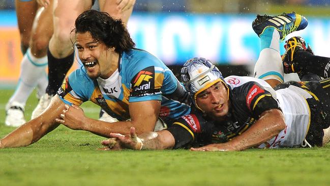 Kevin Gordon of the Titans scores a try during the round four NRL match between the Gold Coast Titans and North Queensland Cowboys at Cbus Super Stadium on March 31, 2014 on the Gold Coast, Australia. (Photo by Matt Roberts/Getty Images)