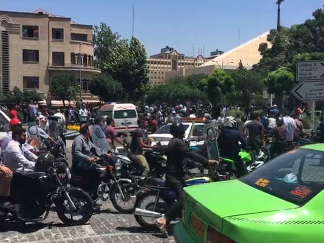 An image grab taken from AFPTV shows the scene outside Iranian parliament in the capital Tehran during an attack on the complex. Picture: AFP / AFPTV / Majid SOURATI