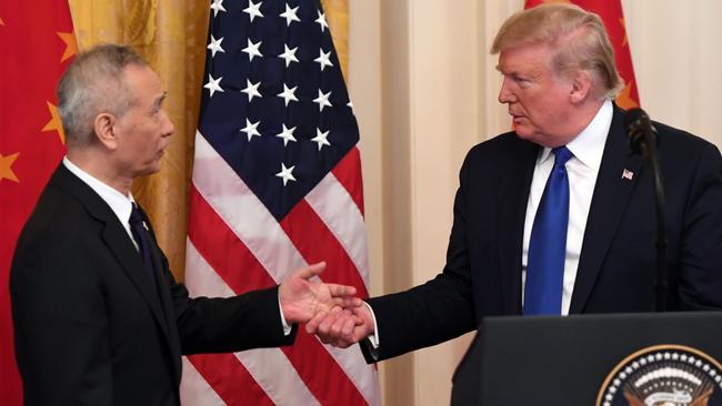 Donald Trump shakes hands with China’s Vice Premier Liu He during a ceremony at the White House. Picture: AFP