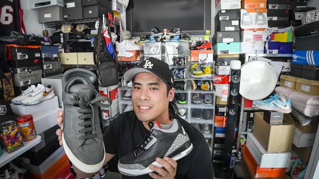 Bobby Truong with some of his favourite sneakers, and his collection, which is worth about $50,000. Picture: Roy VanDerVegt