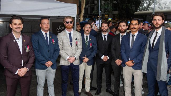 Thousands of people have braved the rain to gather in Brisbane for Anzac Day services. Picture: Grace Kessels