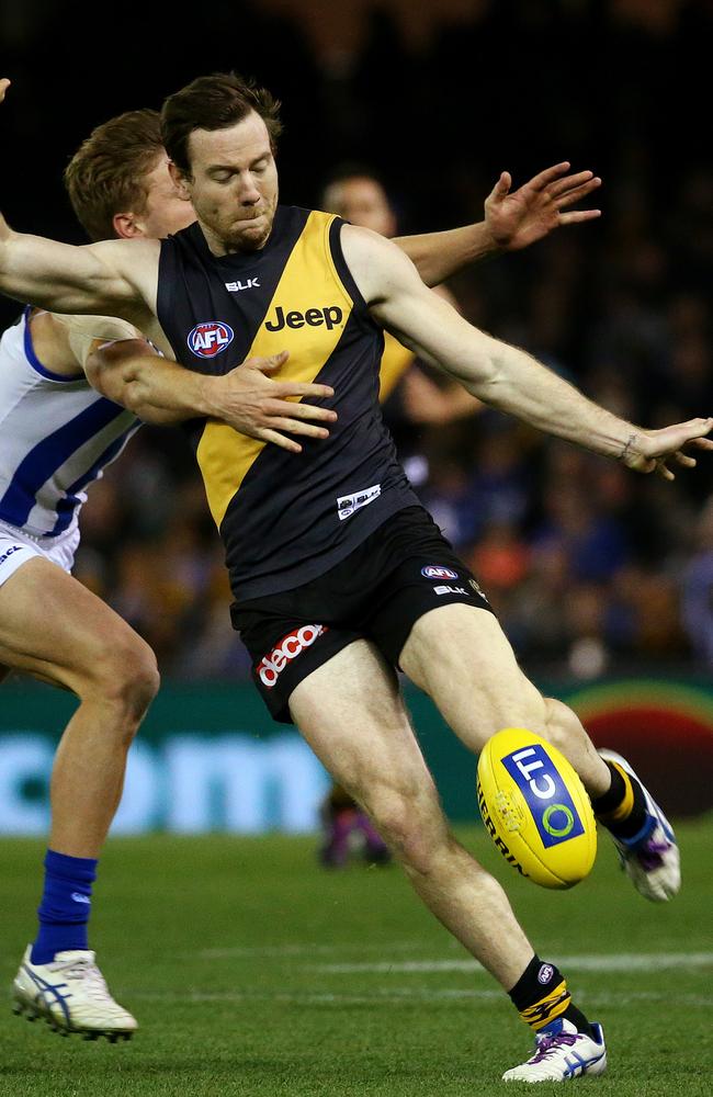 Jake Batchelor takes a kick for the Tigers.