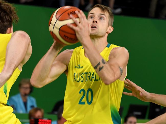 Australia's Nathan Sobey lines up a long range shot during the Men's Preliminary Round Pool A Basketball between Australia and Canada at the XXI Commonwealth Games at the Cairns Convention Centre, Cairns, Australia, Friday, April 6, 2018. (AAP Image/Brian Cassey) NO ARCHIVING, EDITORIAL USE ONLY