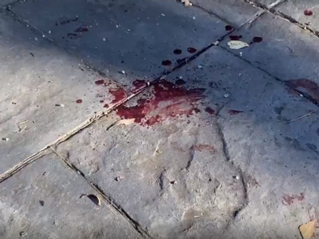 Broken glass and blood on the Eden Hills home driveway. Picture: Gabriel Polychronis
