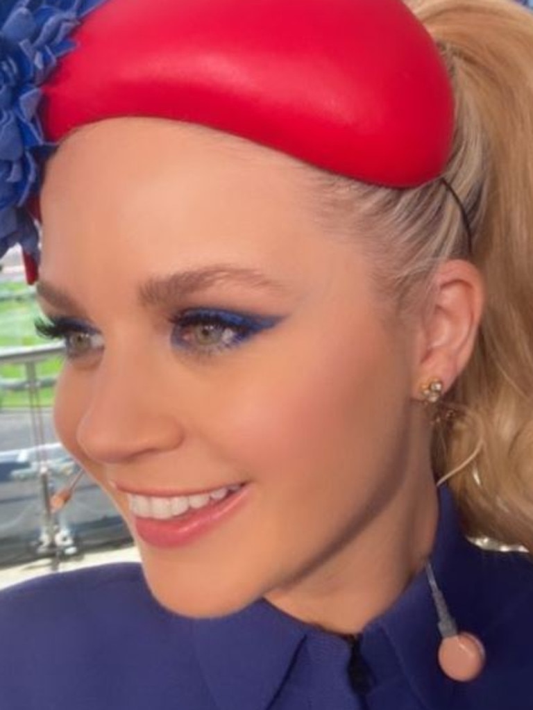 Emma Freedman, a 7 Racing presenter, donned bright blue eye makeup to match her fascinator and outfit. Picture: Instagram/rosesaffioti