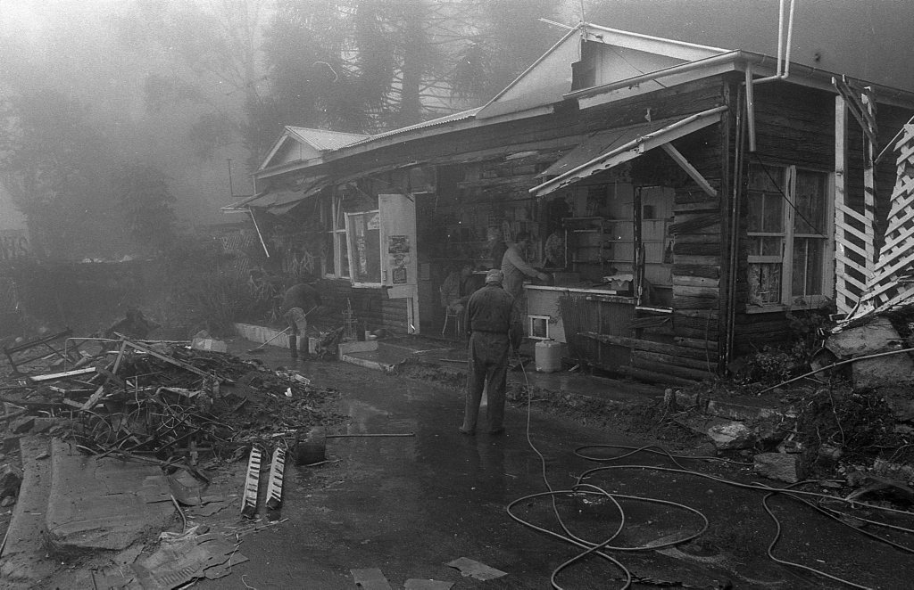 Historic: Toowoomba: Accidents: Clean up at the Log Cabin Service Station the morning after a semi-trailer rolled and crashed in the building removing most of the front of the station. The owner in 1978, Mr Neville Hammond started rebuilding immediately. Photo: Bruce Mackenzie / The Chronicle Neg: U875. Picture: Bruce Mackenzie