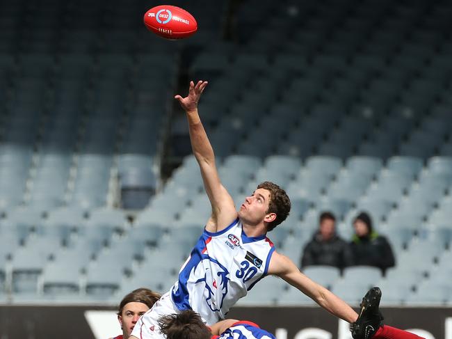 Bailey Wraith goes up in the ruck. Picture: Hamish Blair