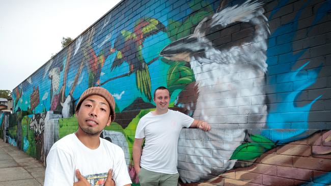 Artist Satoshi Sasayama and Josh Jace at Diamond Creek’s IGA car park.