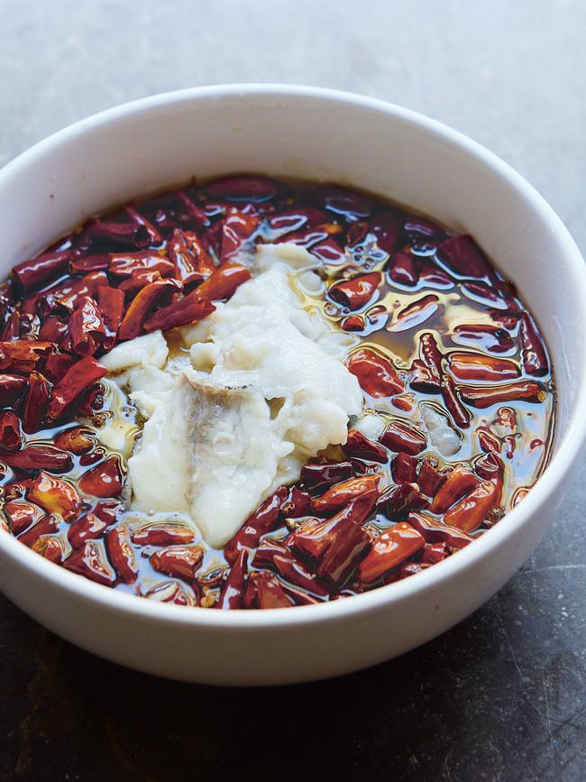 Sizzling fish in a sea of oil. Recipe by Fuchsia Dunlop.