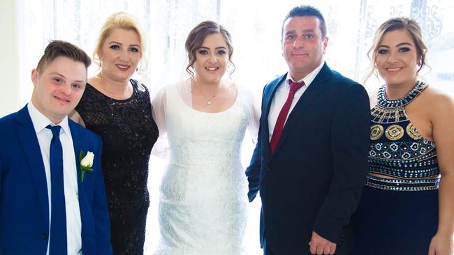 Umit “Ergun” Bolat with his former wife Melek and his three eldest children Umut (son), Merve (wedding dress) and Ebru (daughter on far right). Picture: Supplied