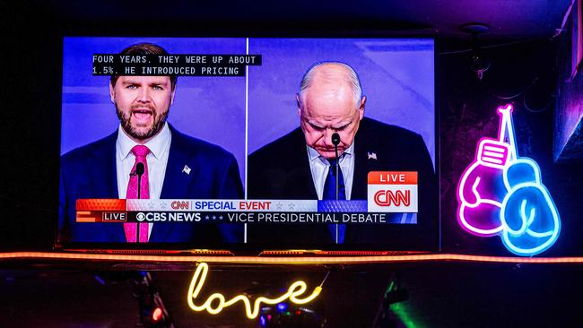 The US vice presidential debate plays on bar televisions within blocks of the CBS Broadcast Center on October 1, 2024 in New York City as JD Vance, left, faces Democratic vice presidential nominee, Minnesota Gov. Tim Walz. Pictur: Getty Images