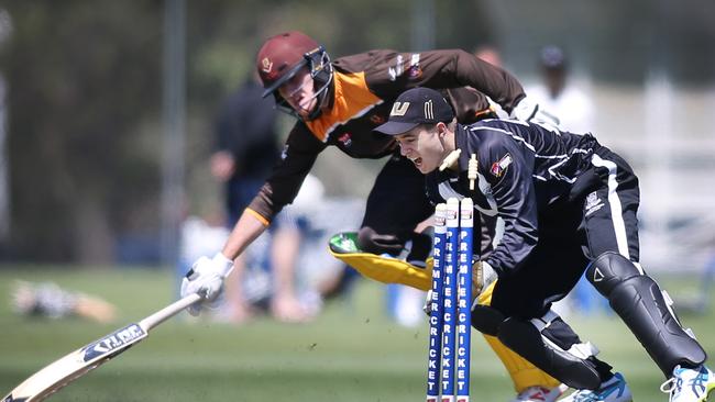 Kensington batsman Henry Dall just makes his ground against Adelaide University. Picture: AAP Image/Dean Martin)