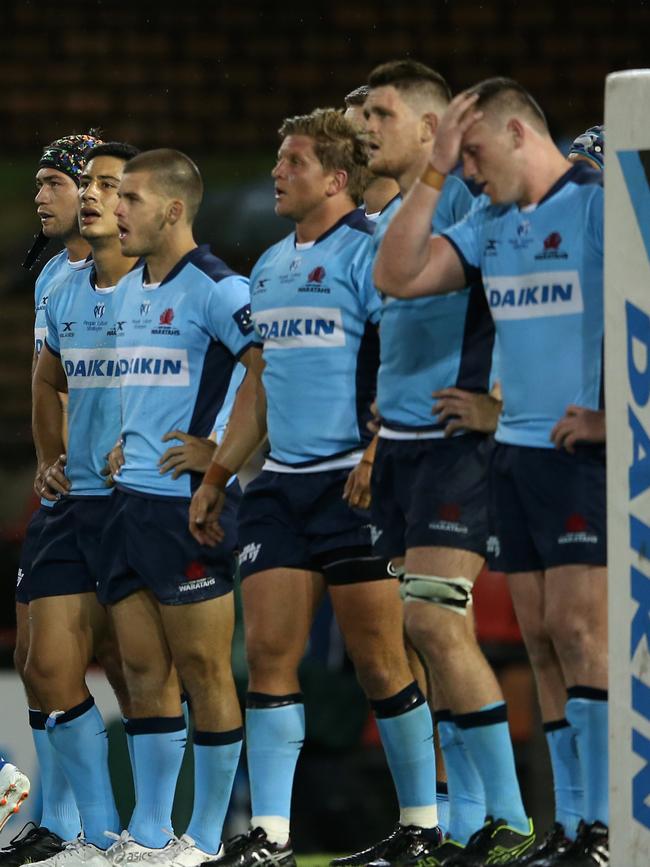 Dejected Waratahs players in Newcastle. Picture: Ashley Feder/Getty