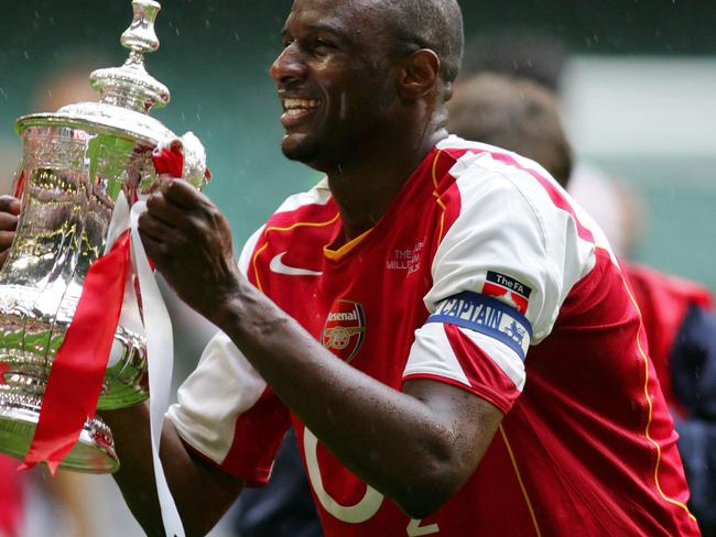 Arsenal's Patrick Vieira lifts the FA Cup after Arsenal defeated Manchester United in the FA Cup Final football match at the Millennium Dome in Cardiff, Wales, 21 May, 2005. The teams tied 0-0 with Arsenal winning 5-4 on penalties. AFP PHOTO/ADRIAN DENNIS No telcos, website uses subject to subscription of a license with FAPL on www.faplweb.com