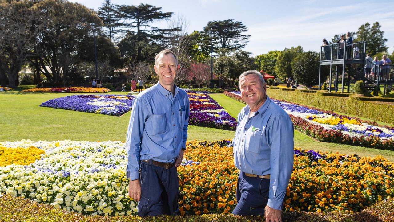 Toowoomba Regional Council Laurel Bank Park team leader Christopher Bluefields (left) and parks and gardens central co-ordinator Karl Grams check on the Laurel Bank floral display during the Carnival of Flowers 2022, Sunday, September 18, 2022. Picture: Kevin Farmer