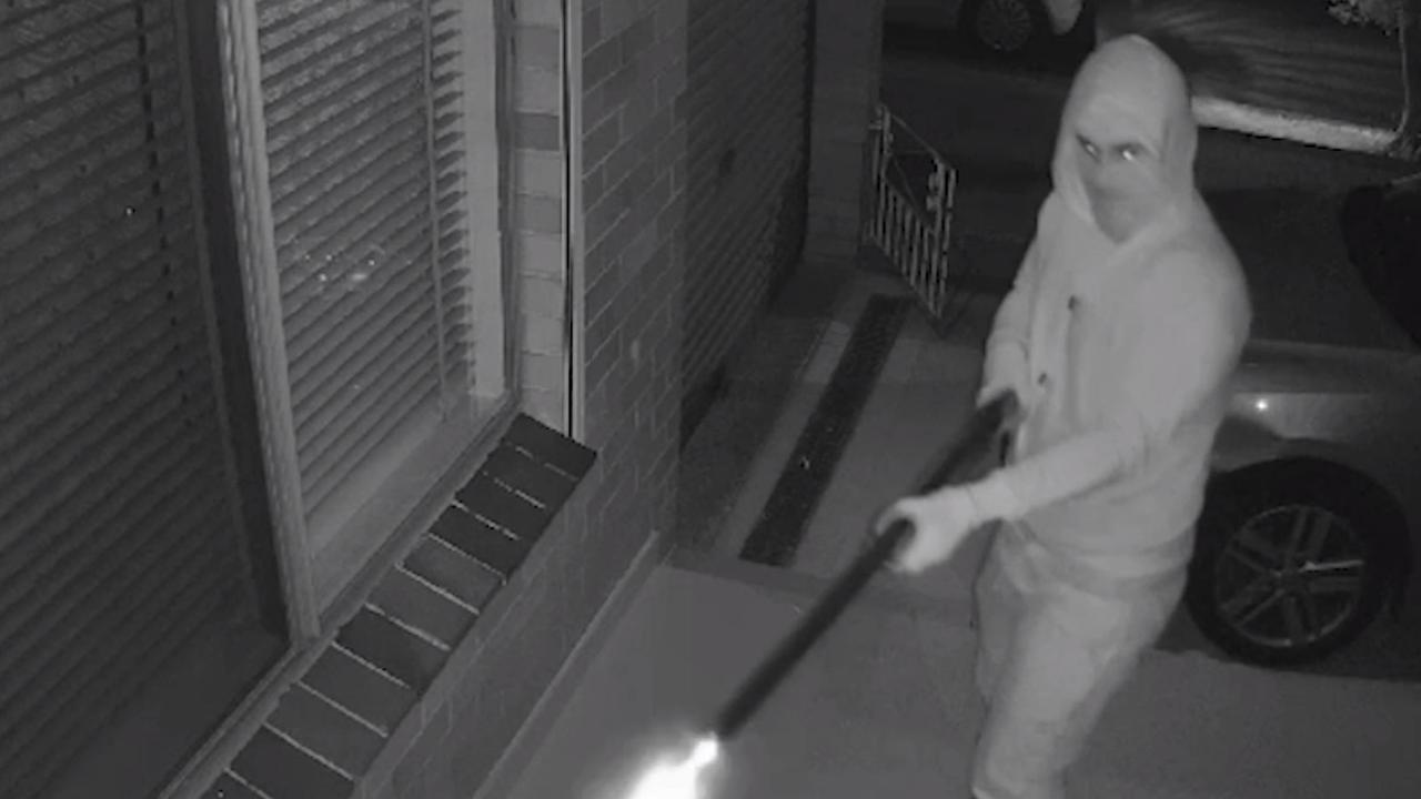 Security camera footage has captured the moment two masked men opened fire into the family home. Source: 9News