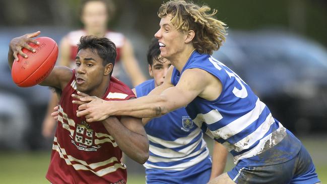 Saints’ Sam Dukalskis (right) attempts to tackle PAC’s Kysaiah Pickett last season. Picture: AAP/Dean Martin