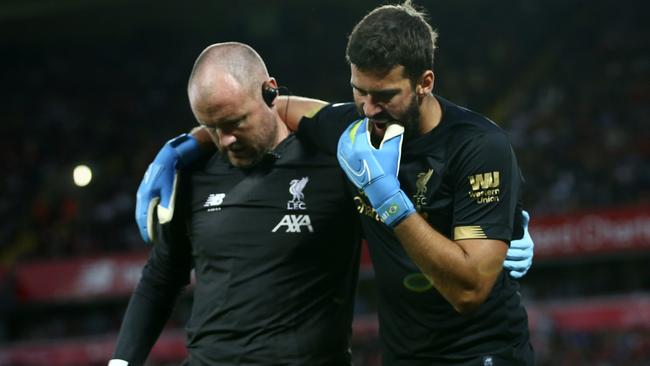 An early injury worry for Liverpool as goalkeeper Alisson Becker limps off.