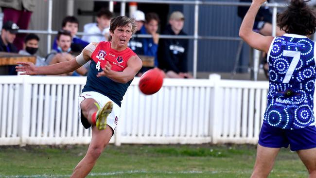 Surfers Paradise player Riley Stone gets a kick away QAFL Aussie rules match between Mt Gravatt and Surfers Paradise. Saturday July 17, 2021. Picture, John Gass