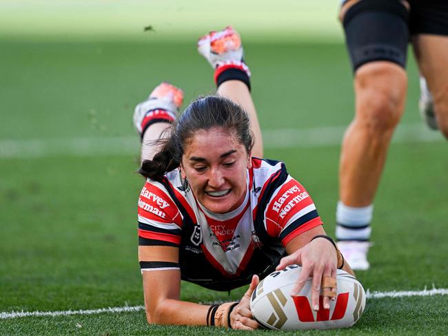 Sydney Roosters' Olivia Kernick scores a try during the National Rugby League (NRL) Women's Grand Final match between Sydney Roosters and Cronulla Sharks at Accor Stadium in Sydney on October 6, 2024. (Photo by Izhar KHAN / AFP) / -- IMAGE RESTRICTED TO EDITORIAL USE - STRICTLY NO COMMERCIAL USE --