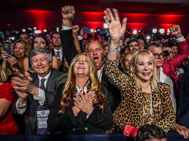 TOPSHOT - Supporters of Republican gubernatorial candidate for Florida Ron DeSantis cheer during an election night watch party at the Convention Center in Tampa, Florida, on November 8, 2022. - Florida Governor Ron DeSantis, who has been tipped as a possible 2024 presidential candidate, was projected as one of the early winners of the night in Tuesday's midterm election. (Photo by Giorgio VIERA / AFP)