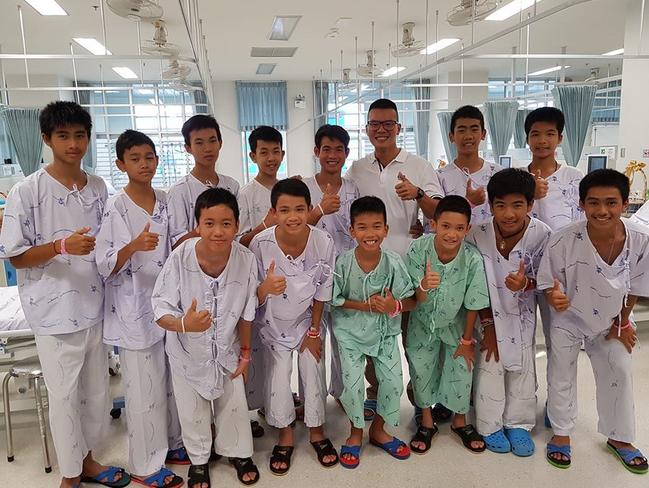 Dr Pak Loharachun, wearing glasses, with the Wild Boars soccer team in hospital. <br/>Picture: Facebook