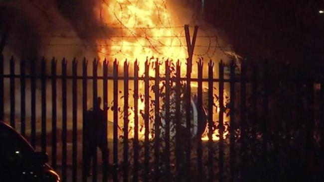 The burning helicopter in a parking lot outside the King Power Stadium in Leicester. Picture: AP