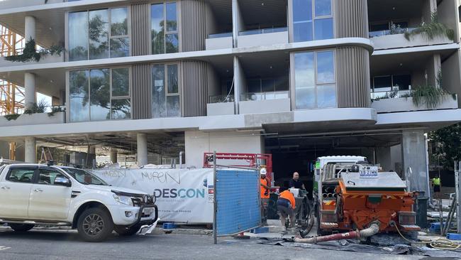 Some subbies were removing equipment and supplies, while other kept working, at the site of Waverley Residences in Southport, the day its builder Descon Group Australia went into liquidation.