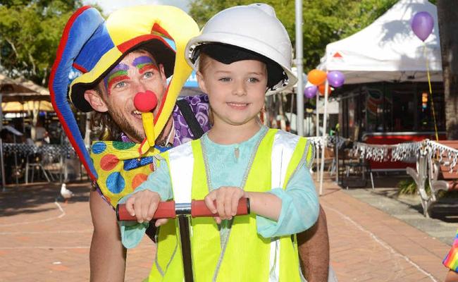 Chloe Coleman with a clown from the Coffs Coast Community Circus. Picture: Leigh Jensen