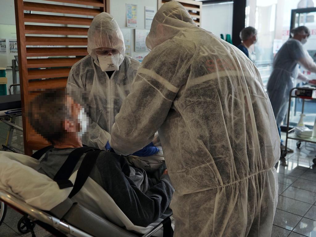 Medical personnel prepare a Covid-19 infected patient upon his arrival at the intensive care department in France. Picture: Guillaume Souvant/AFP