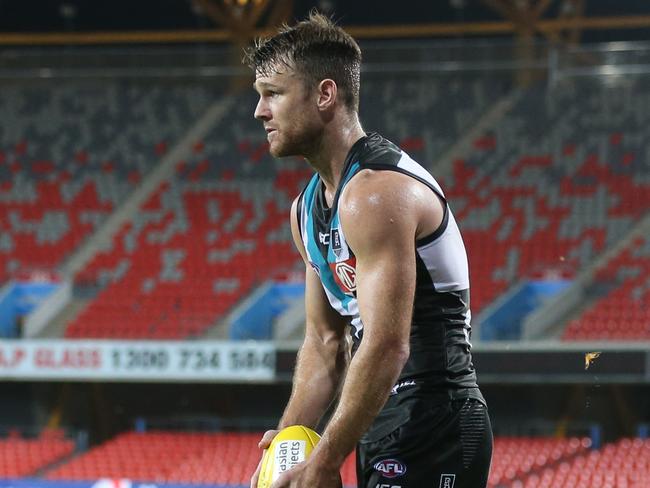 GOLD COAST, AUSTRALIA - MARCH 21: Robbie Gray of the Power kicks during the round 1 AFL match between the Gold Coast Suns and the Port Adelaide Power at Metricon Stadium on March 21, 2020 in Gold Coast, Australia. (Photo by Chris Hyde/Getty Images)