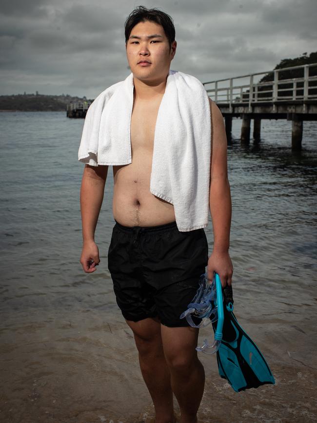 Korean tourist Min Seung Gi who this morning was snorkelling outside of the shark nets at Clifton Gardens in Mosman. Picture: Julian Andrews