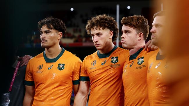 A dejected Jordan Petaia, Mark Nawaqanitawase and Andrew Kellaway. Picture: Chris Hyde/Getty Images