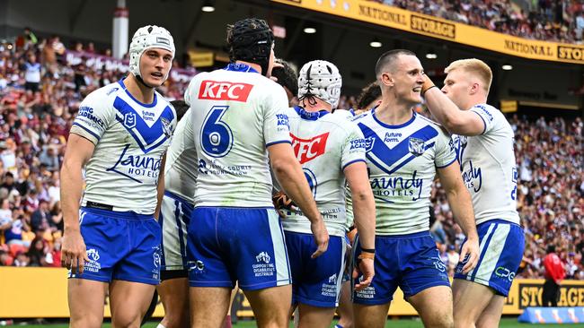 BRISBANE, AUSTRALIA - JULY 27: Bulldogs celebrate a try during the round 21 NRL match between Brisbane Broncos and Canterbury Bulldogs at Suncorp Stadium, on July 27, 2024, in Brisbane, Australia. (Photo by Albert Perez/Getty Images)