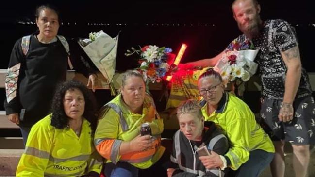 Workmates of Brendan Moreland pay tribute to the popular traffic controller at the site where he died. Back: Mirikia Ahmat and Matthew WellingtonFront: Sharon Ahmat, Deliah Serruerier, Nezzy Falzon and Robyn 'Robbi' Mapley.