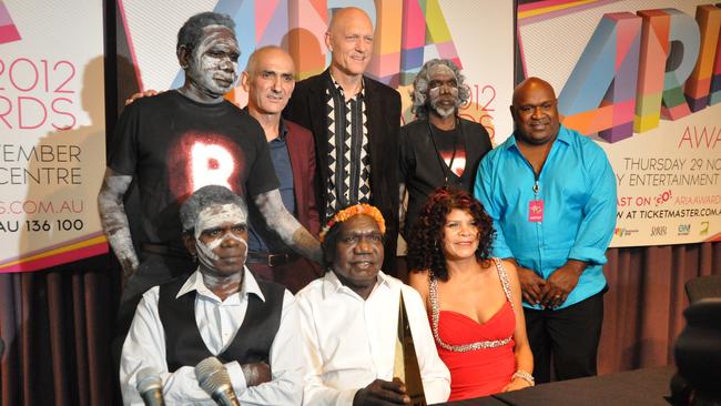 Yothu Yindi (with Paul Kelly and Peter Garrett) after being inducted into the ARIA Hall of Fame in 2012. Back: Witiyana Marika, Kelly, Garrett, Mangatjay Yunupingu, Ben Hakalitz. Front: Malngay Yunupingu, Mandawuy Yunupingu and Jodie Cockatoo. Picture: Matt Garrick