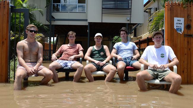 University students sit outside their rental property in Torwood street, in the inner city suburb of Rosalie in Brisbane. Picture: AAP/Dave Hunt