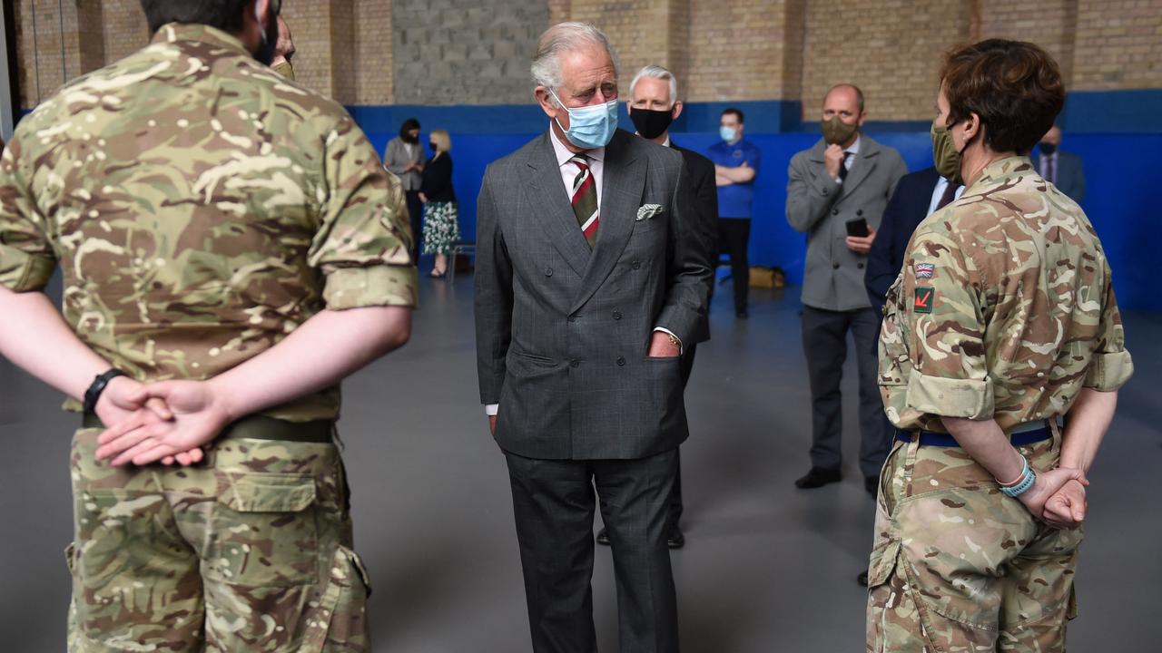 Prince Charles met with members of Britain's Royal Air Force (RAF) who helped during the mass testing for Covid-19 in South Wales, as part of his visit to the Engine House youth charity. Picture: Jacob King / Pool / AFP