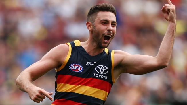 Rory Atkins of the Crows celebrates after kicking a goal during the round one AFL match between the Adelaide Crows and the GWS Giants at Adelaide Oval on March 26, 2017 in Adelaide, Australia.