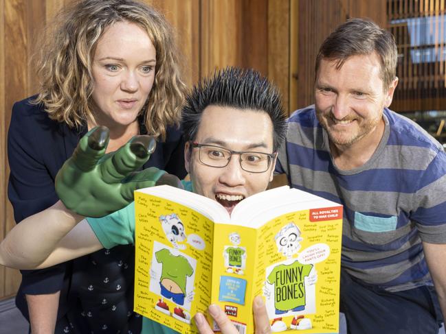 Childrens authors Oliver Phommavanh (centre) and Kate and Jol Temple. Picture: Matthew Vasilescu