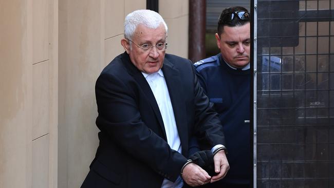 Ron Medich is escorted to a NSW Corrective services van at the NSW Supreme court in Sydney today. Picture: AAP