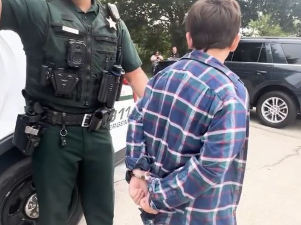 Footage released by the sheriff’s office showed the boy with handcuffs on being marched into an empty cell. Picture: Volusia County Sheriff’s Office