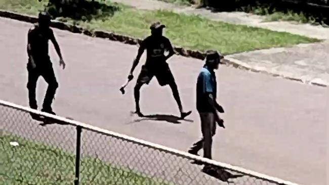 Men fighting in the street in Darwin on Friday.