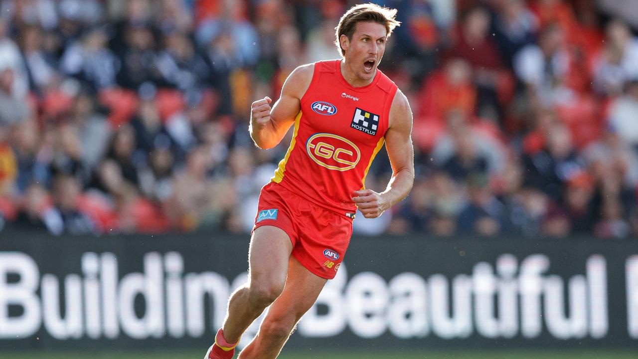 GOLD COAST, AUSTRALIA - AUGUST 19: David Swallow of the Suns celebrates a goal during the 2023 AFL Round 23 match between the Gold Coast SUNS and the Carlton Blues at Heritage Bank Stadium on August 19, 2023 in Gold Coast, Australia. (Photo by Russell Freeman/AFL Photos via Getty Images)