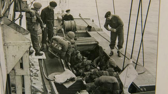 Coxswain Sergeant Charles Oram, aged 20, standing on right, during the D-Day Landings.