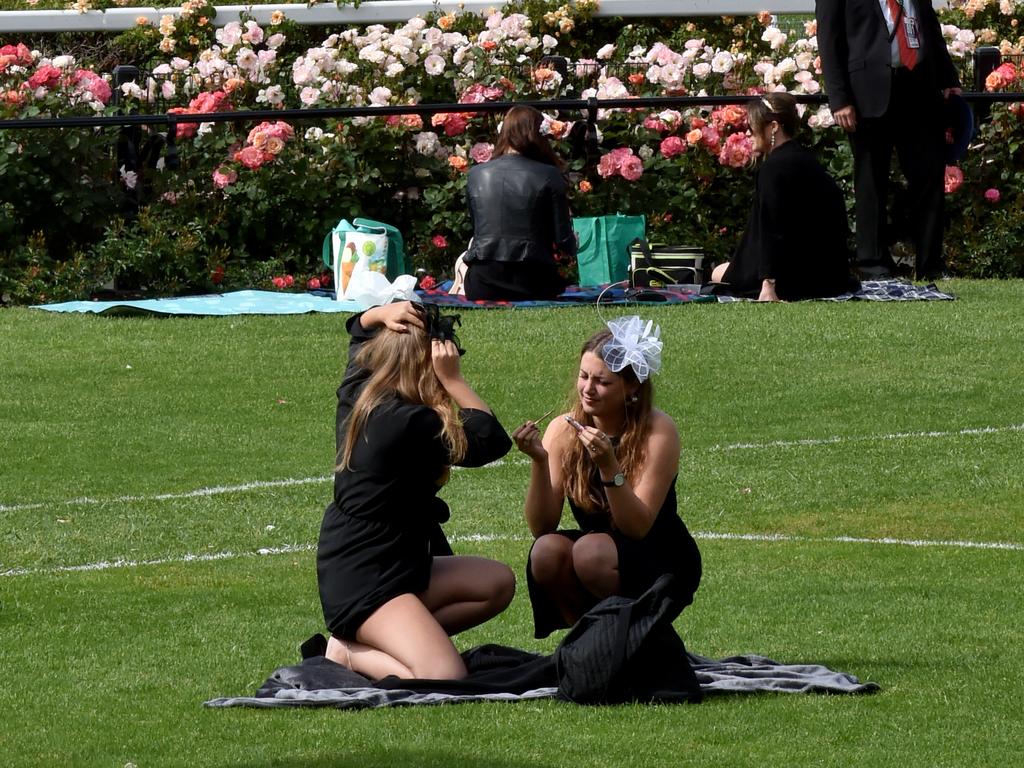 Two women put on the finishing touches. Picture: Jay Town